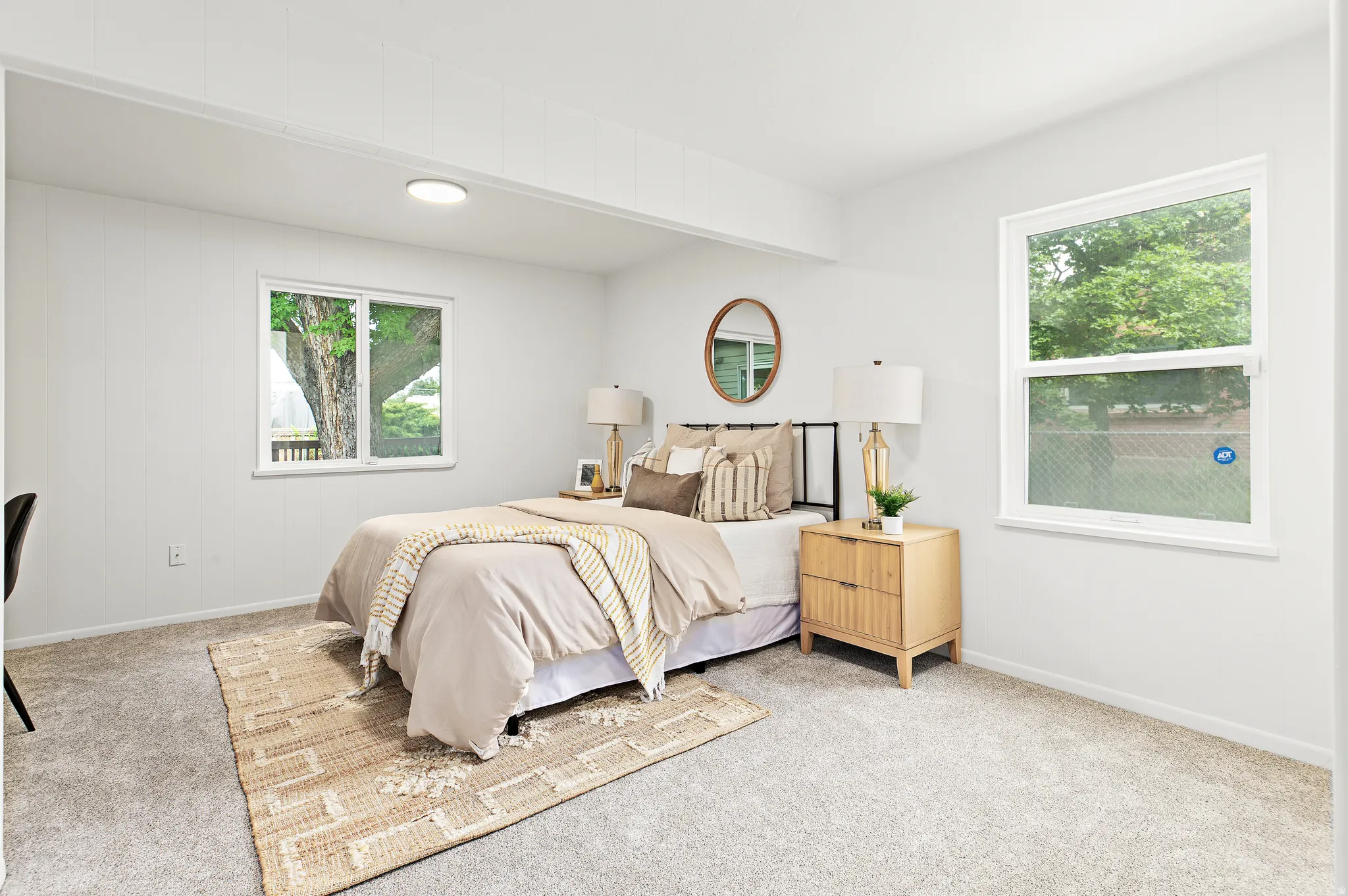 Neutral wall paint enhancing natural light from multiple windows