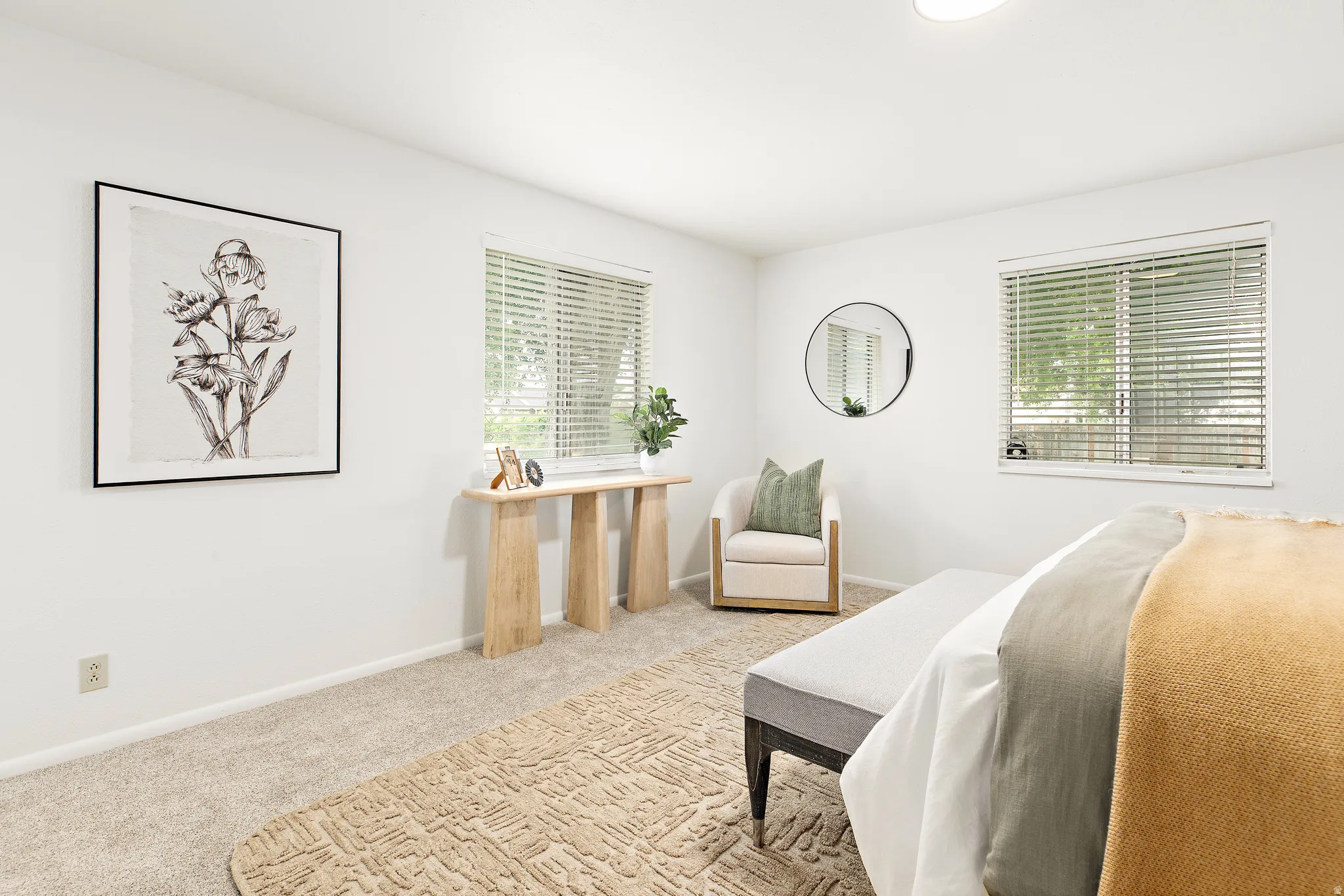 Light-colored wall-to-wall carpeting throughout the room