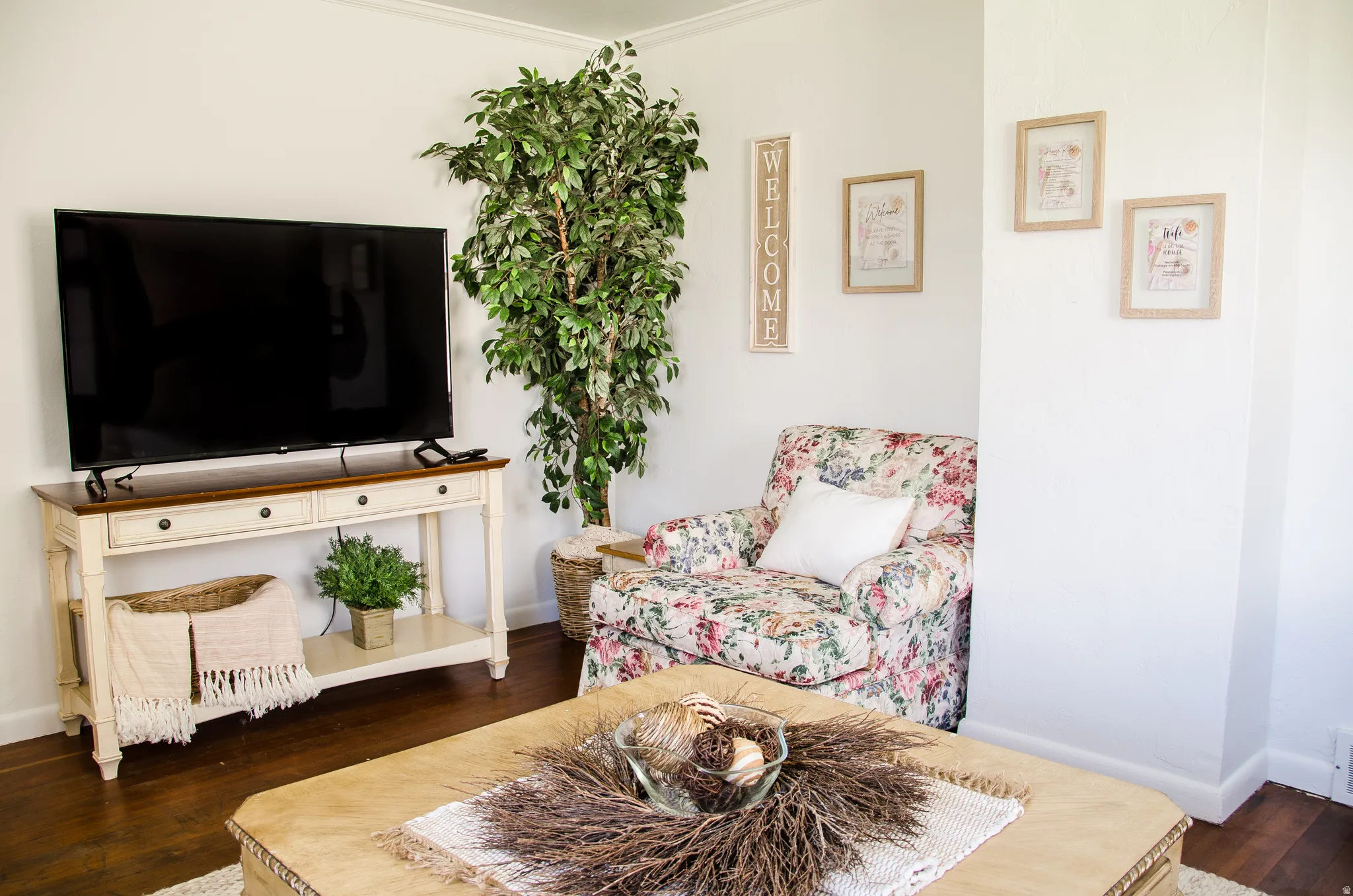 White interior walls with dark wood-finish flooring
