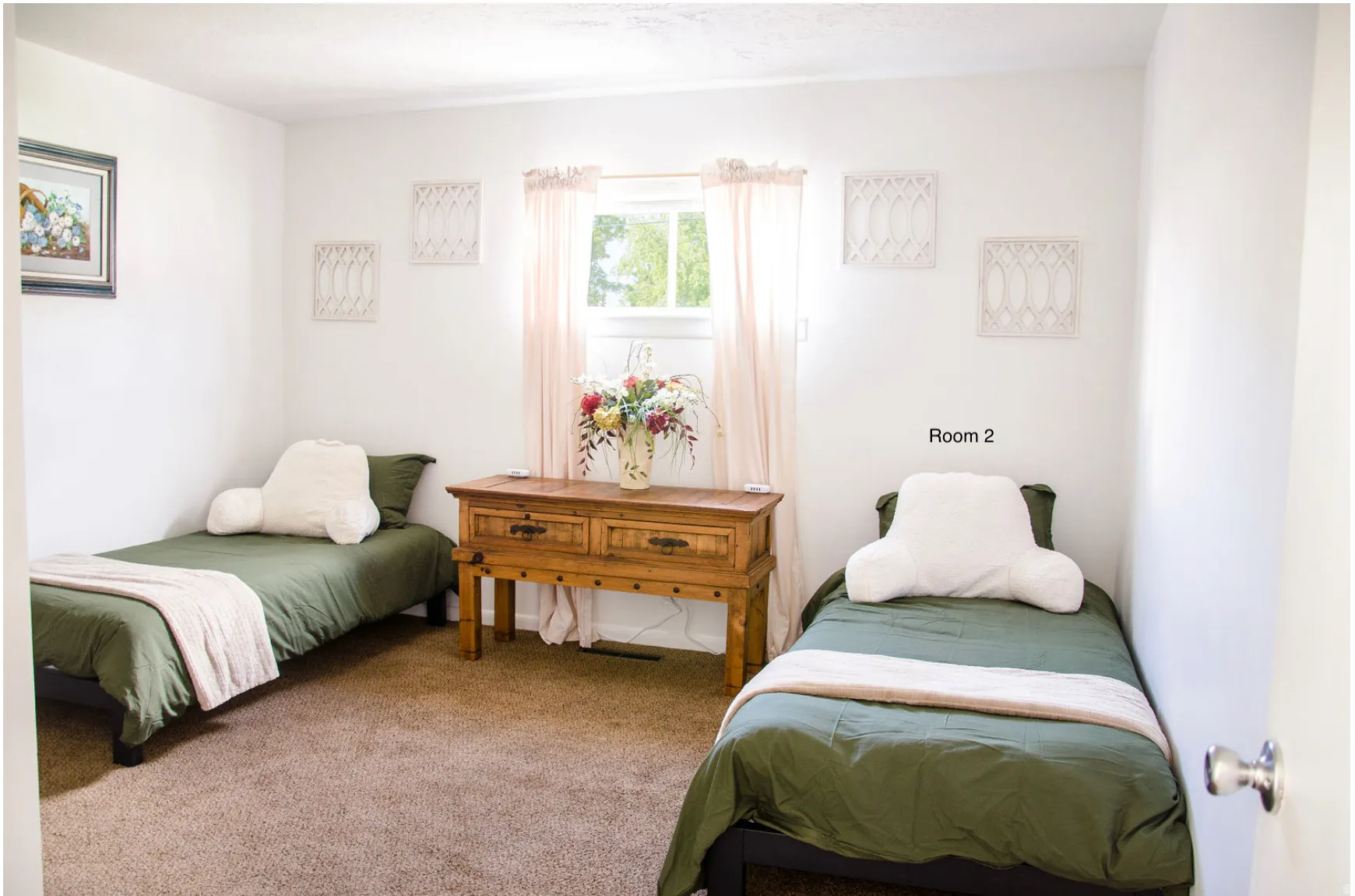 Light-filled bedroom featuring white walls, a single window, and brown carpeting