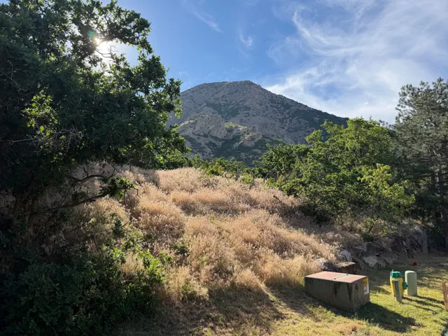 View of Malan's Peak to the East - Mountain backdrop featuring an expansive natural landscape with mature trees and arid vegetation