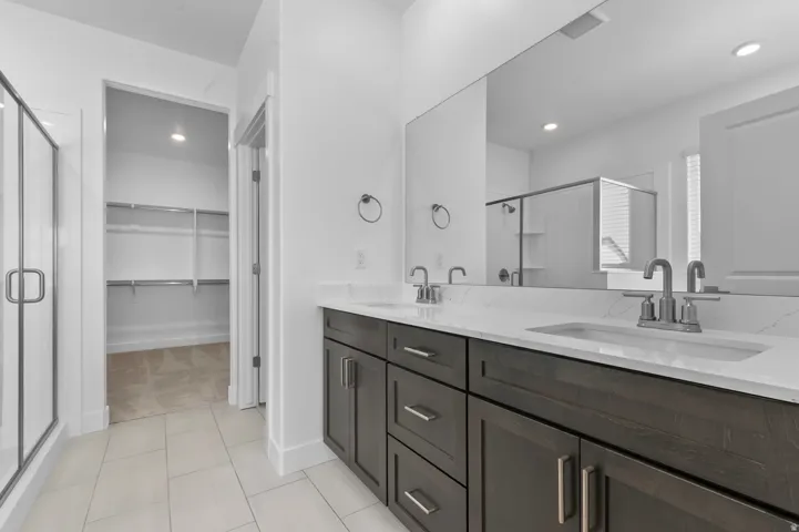 Double vanity with integrated sinks and brushed nickel fixtures