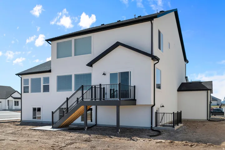 Contemporary white exterior featuring multiple large windows