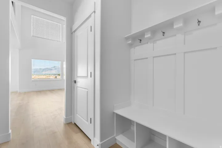 Built-in entryway bench with storage cubbies and coat hooks
