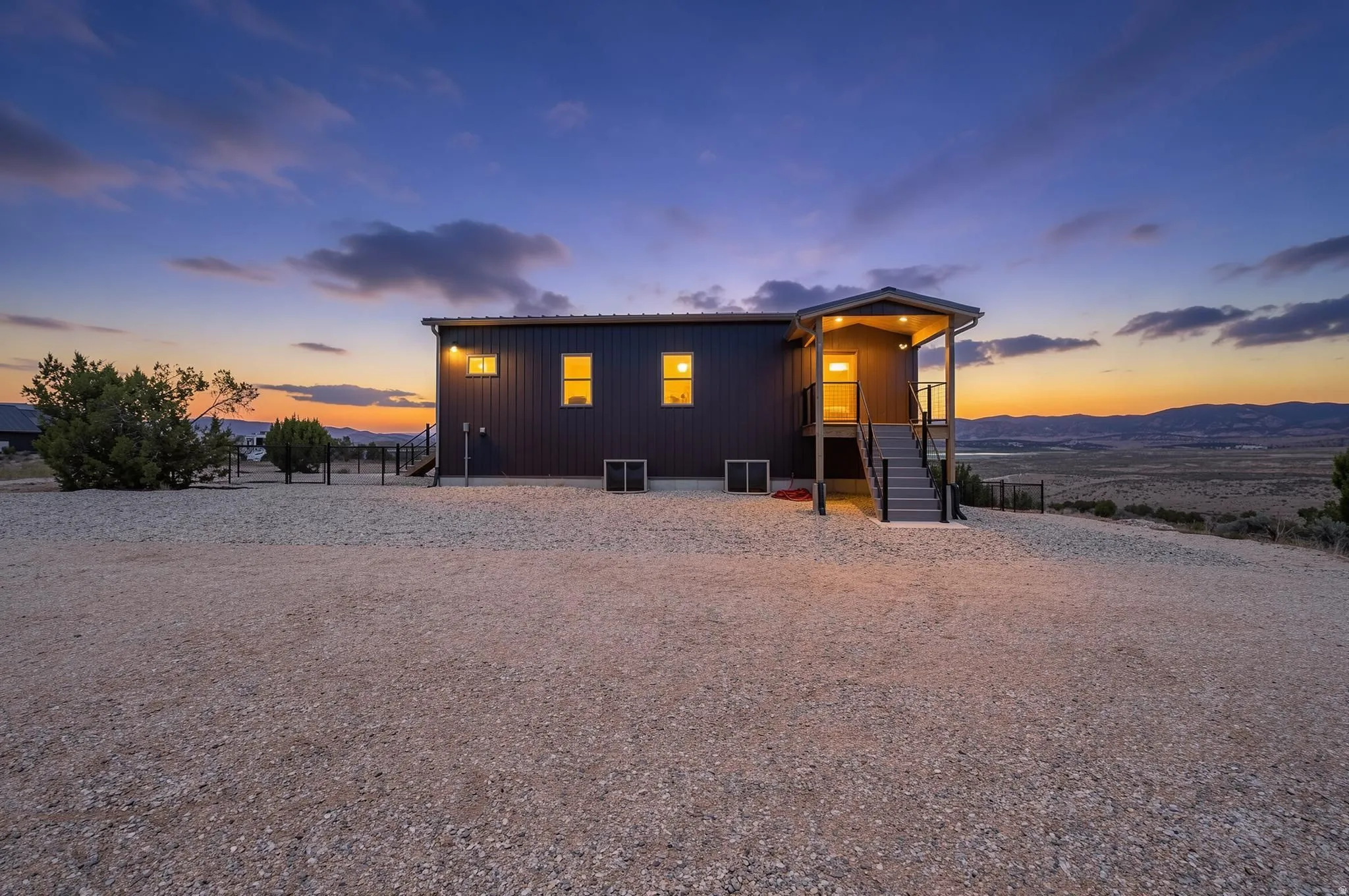 Modern single-story residence featuring a dark corrugated metal exterior
