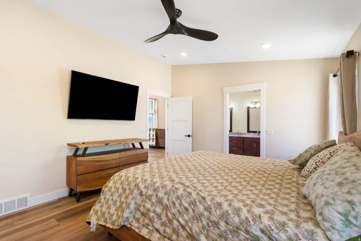 Bedroom featuring wood-finish flooring, recessed lighting, and a contemporary ceiling fan
