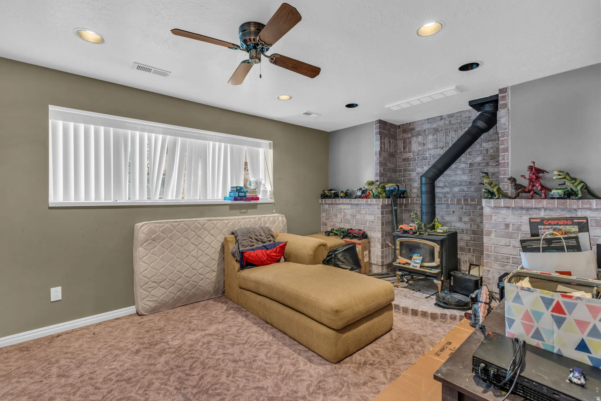 Brick-clad wood-burning stove with a raised hearth