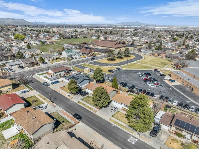 Aerial perspective showcasing a residential neighborhood with surrounding infrastructure
