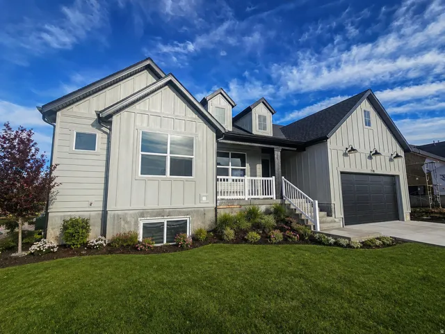 Contemporary light gray exterior with board and batten and horizontal siding