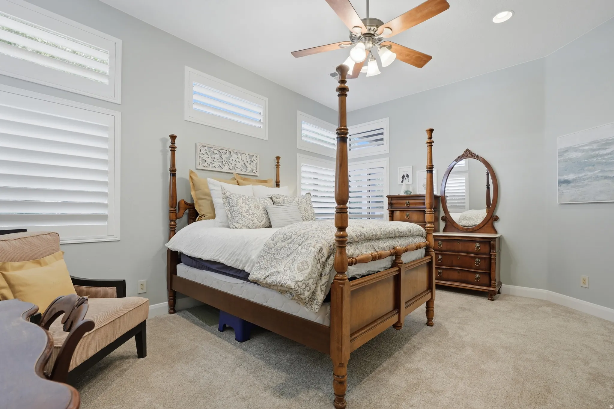 Spacious room featuring light gray wall paint and beige carpet flooring