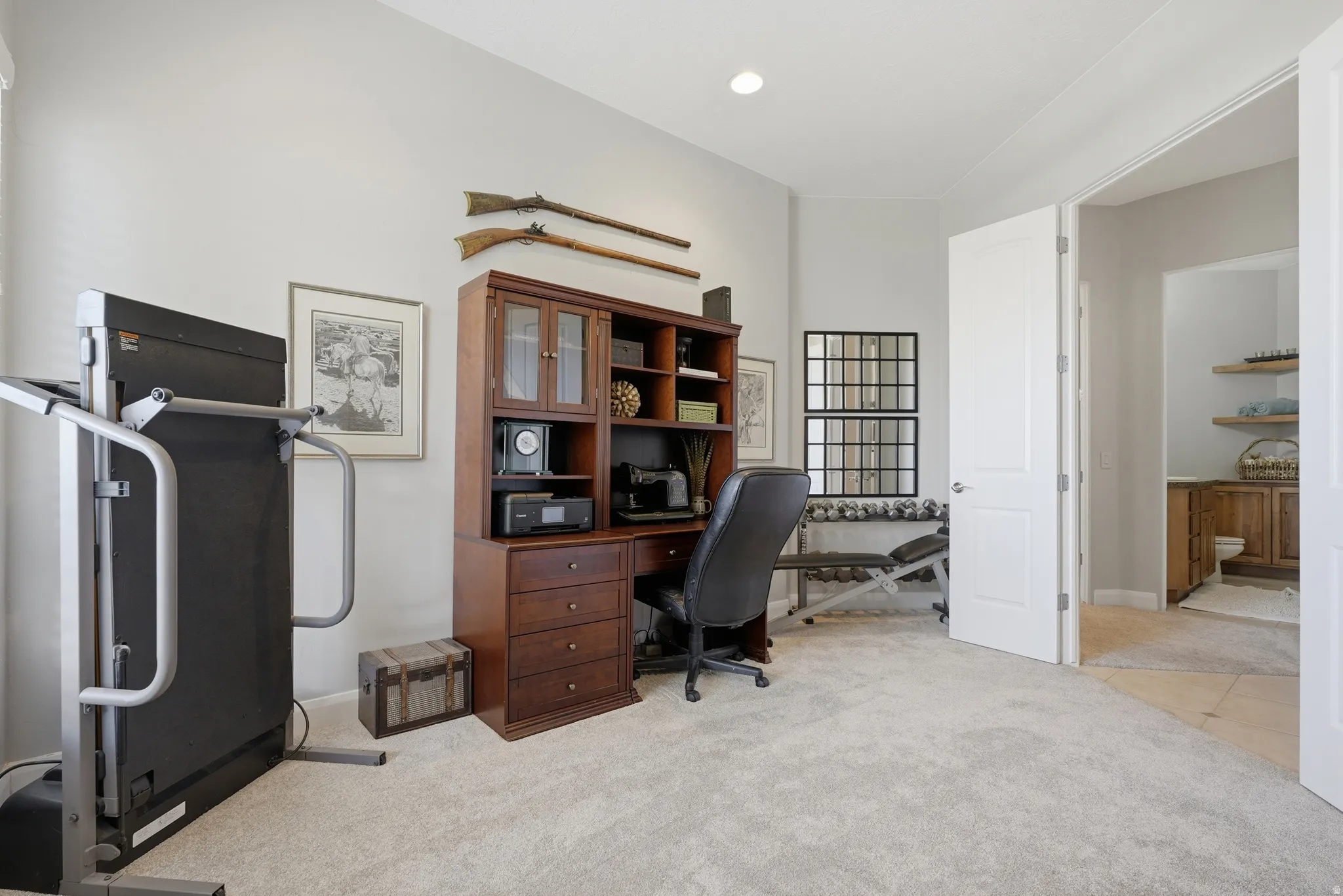 Versatile room featuring light-toned carpeting and neutral wall paint