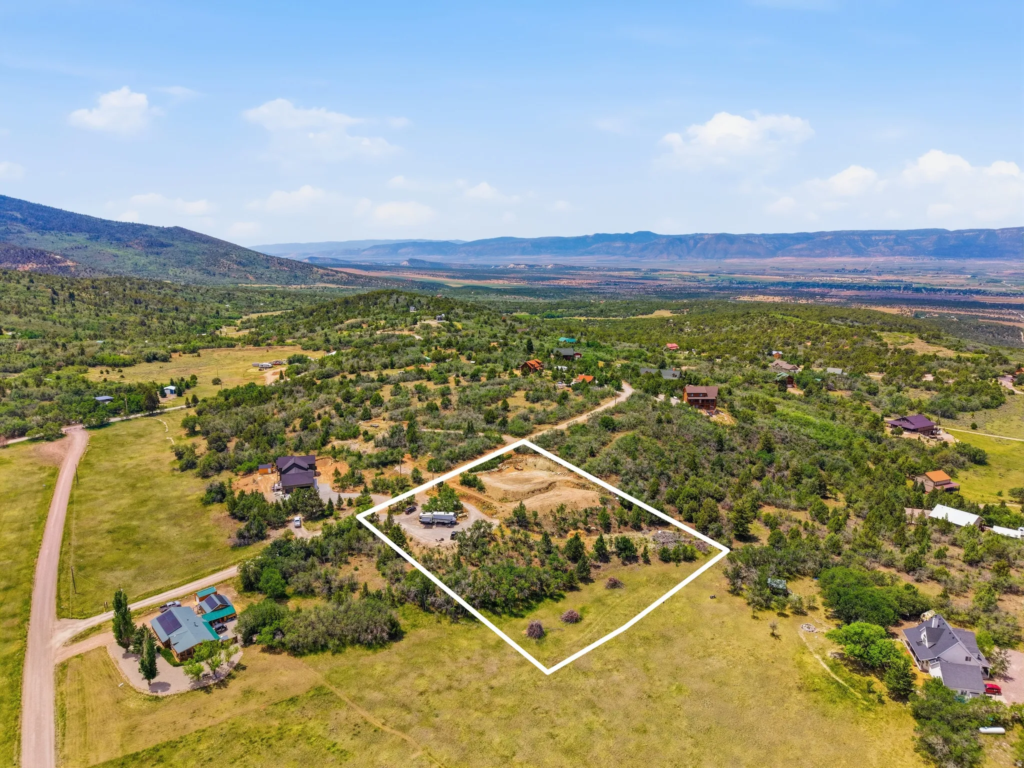 Expansive lot featuring a natural landscape and distant mountain ranges