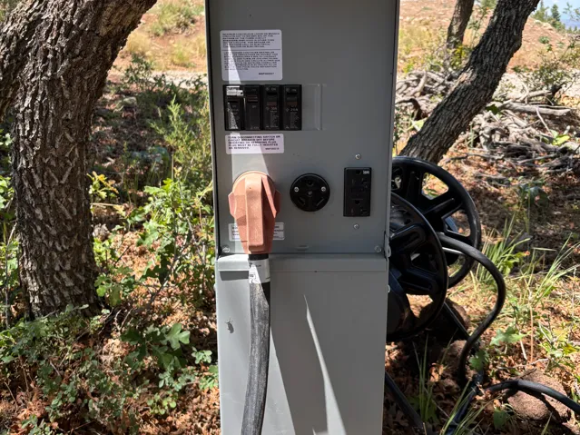 RV pedestal installed with 50, 30, and 20 amp connections that can run two at the same time. It can also handle an electric vehicle charging station.