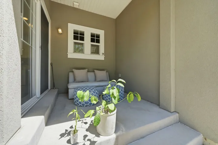 Covered outdoor patio featuring concrete flooring and a stucco exterior