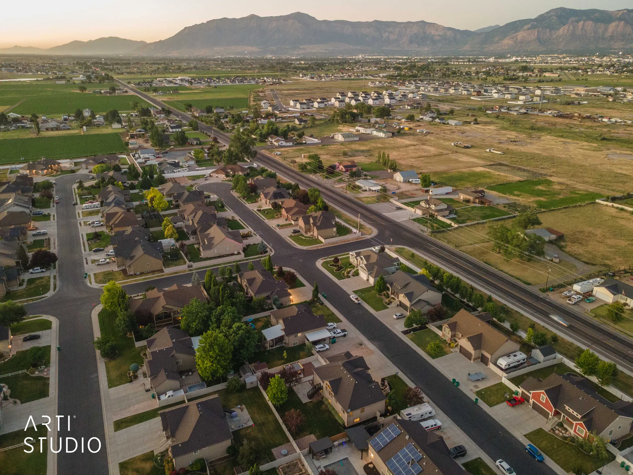 Aerial perspective showcasing a residential community with single-family homes and mature landscaping