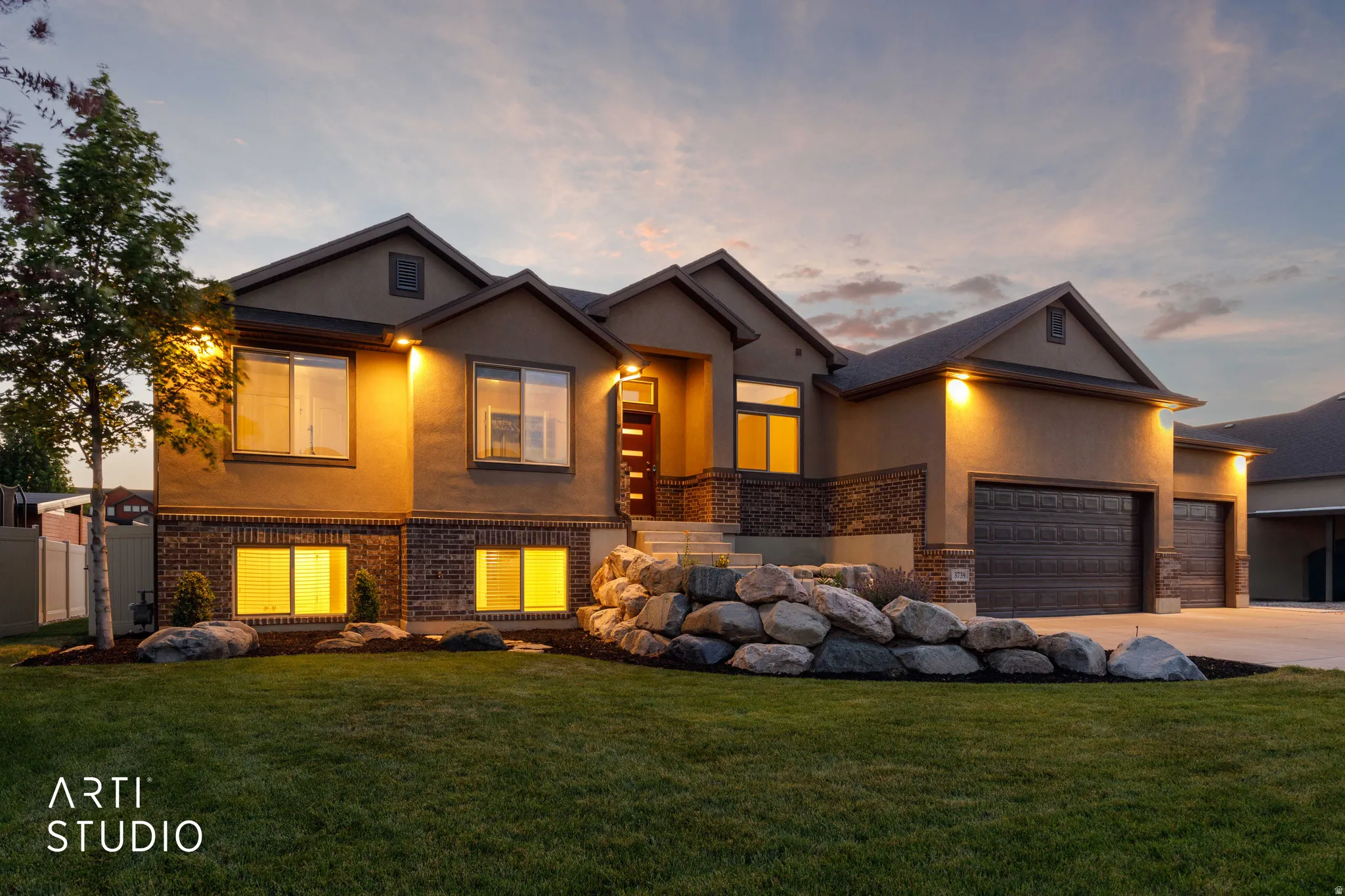 Contemporary exterior featuring stucco and brick accents