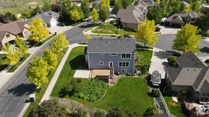 Two-story residence featuring a gray exterior and a shingle roof