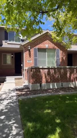 Brick facade with a gabled entry