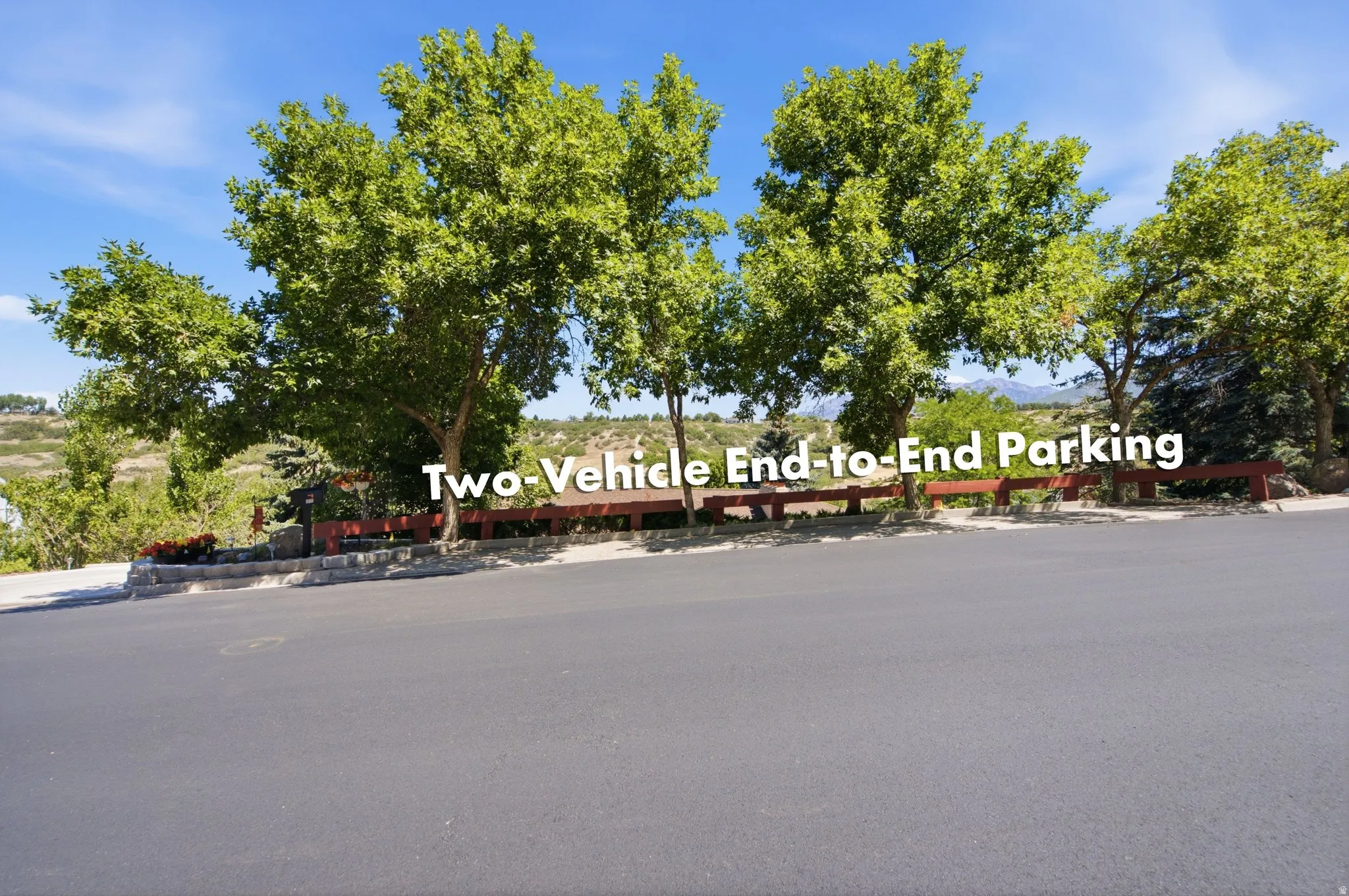 Paved driveway featuring two-vehicle end-to-end parking