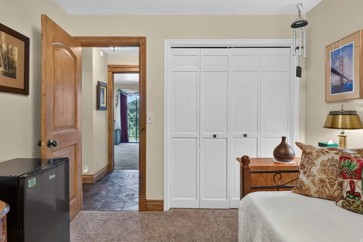 White bi-fold closet doors with panel detailing