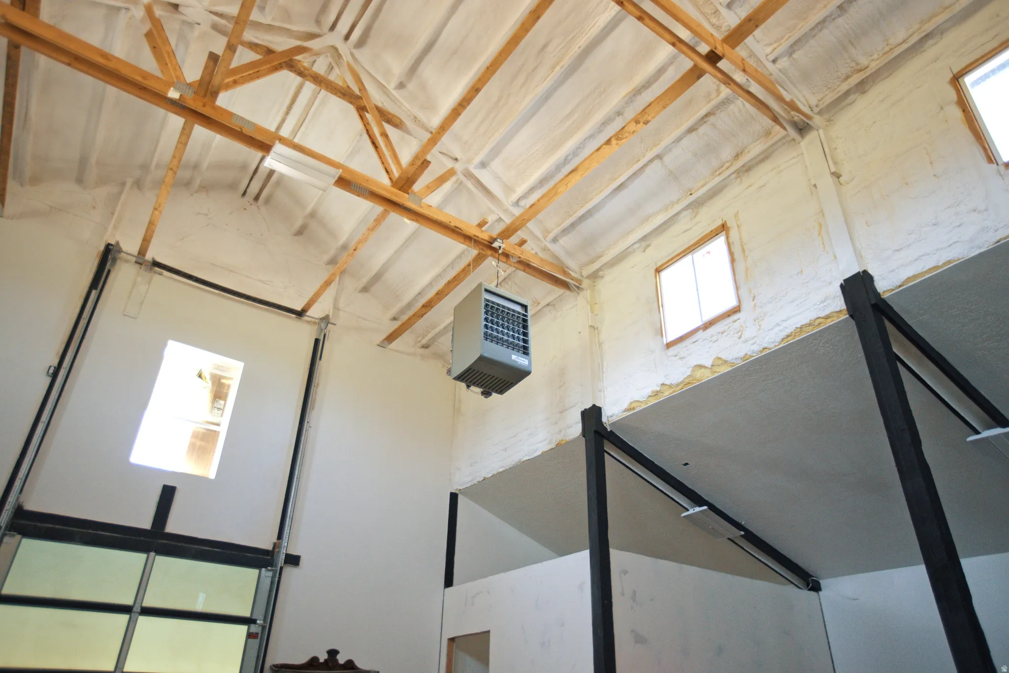 Vaulted ceiling with exposed wood beams
