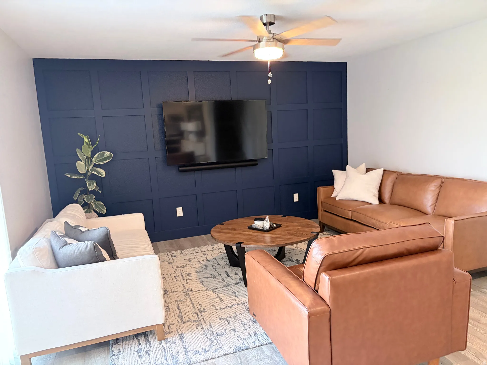 Accent wall featuring deep blue paneling