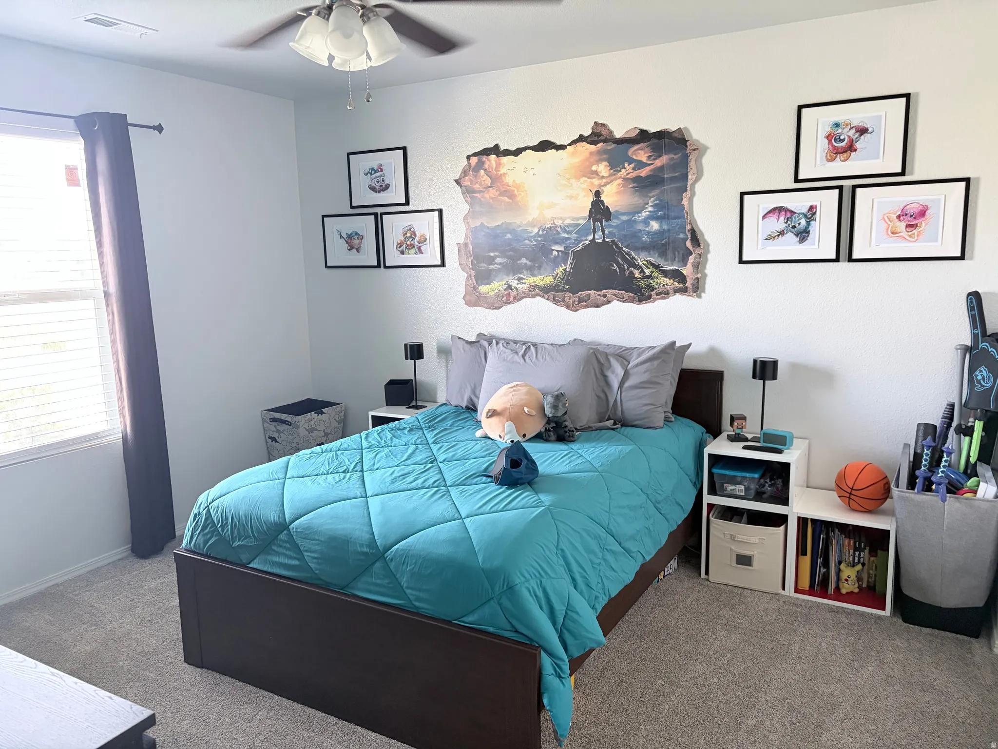 Bedroom featuring a ceiling fan with light fixture, neutral carpeting, and a window with blinds and curtains
