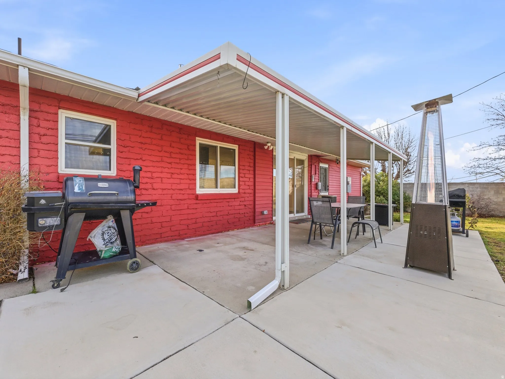 Expansive concrete patio offering ample outdoor space