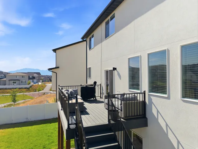 Elevated deck featuring composite decking and black metal railings