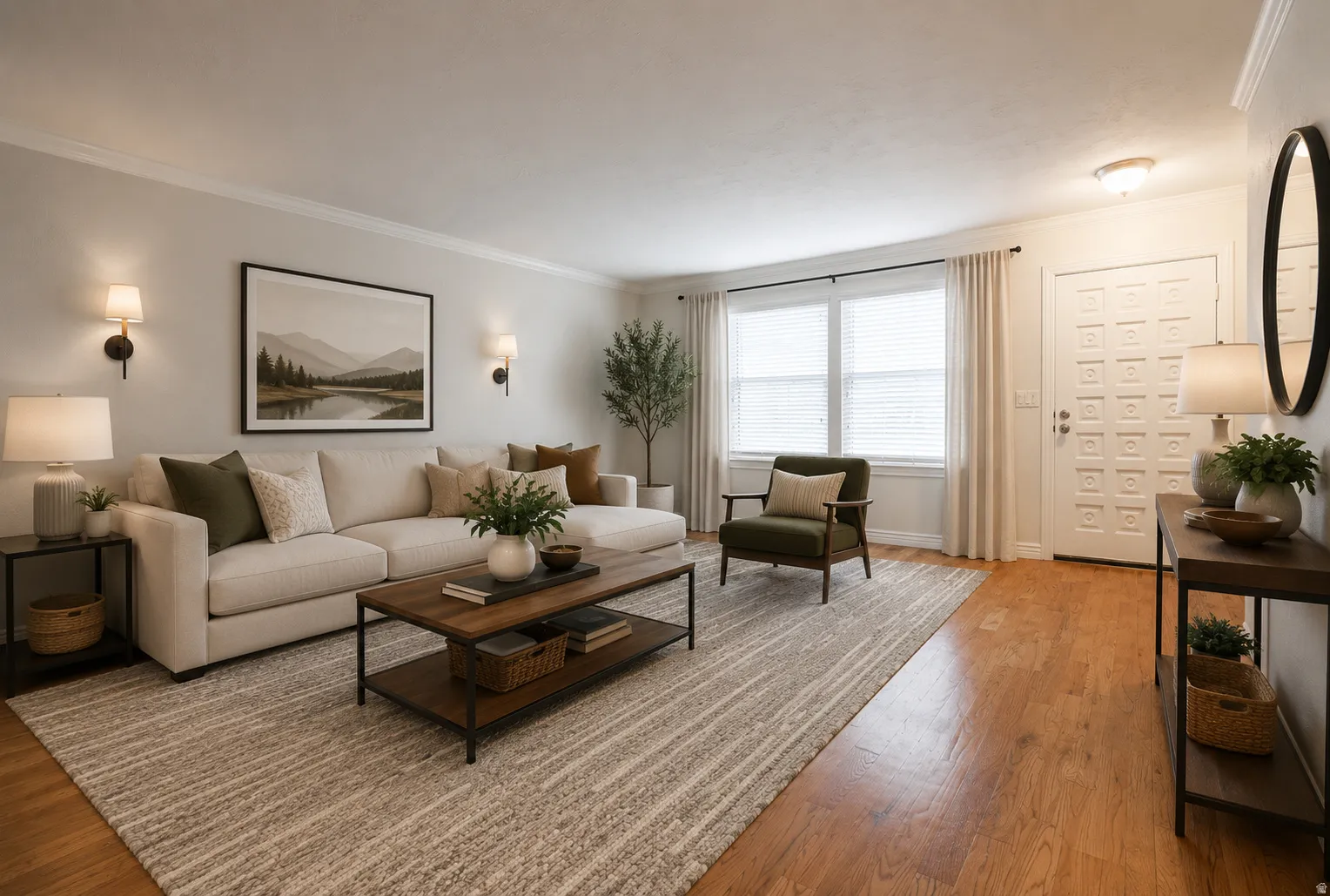 Digitally Staged. Bright living space featuring wood-finish flooring and a paneled entry door