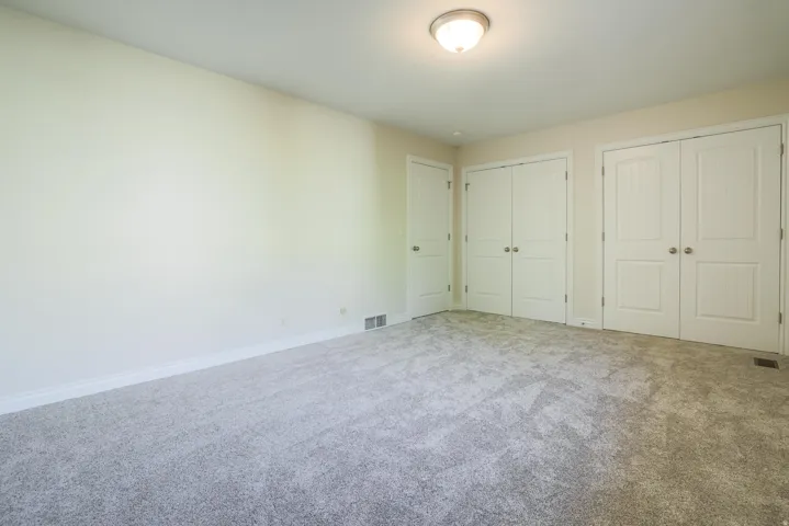 Neutral-toned walls complement the new carpeting