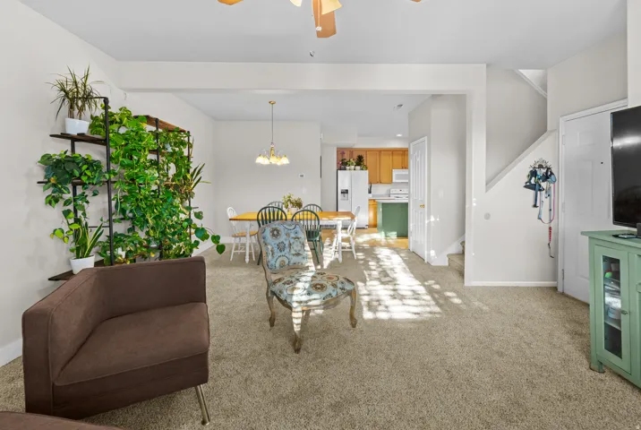 Living room with new carpet great natural lighting and open floor plan that flows natural with the home