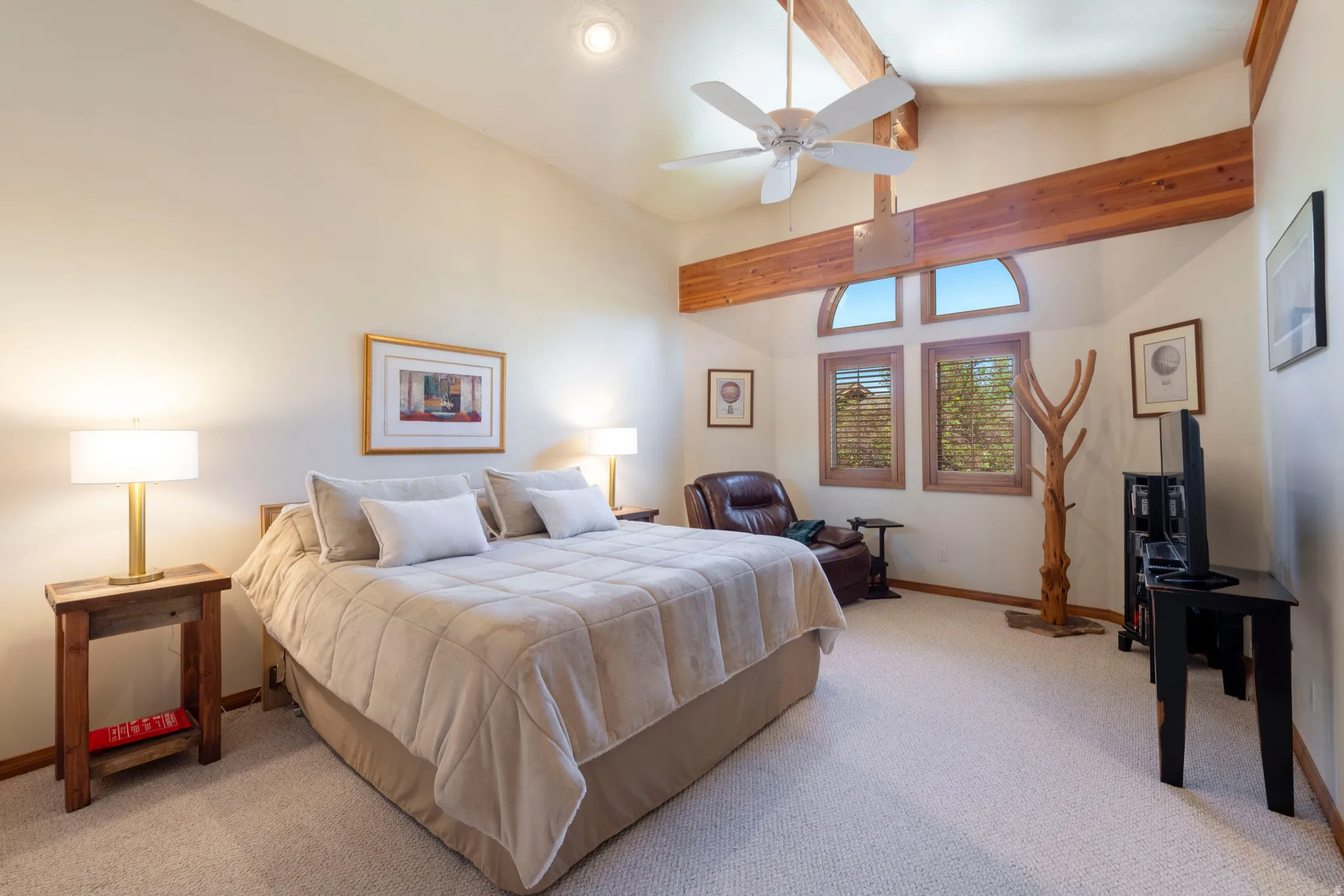 Vaulted ceiling with exposed wood beams, ceiling fan, and recessed lighting