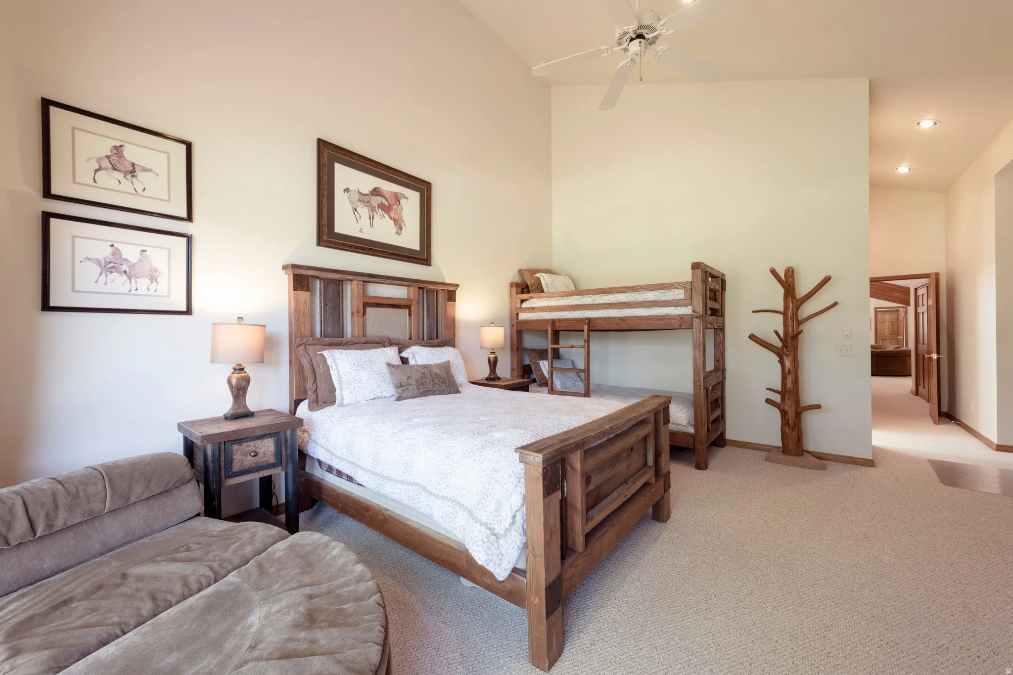 Vaulted ceilings present an expansive bedroom space