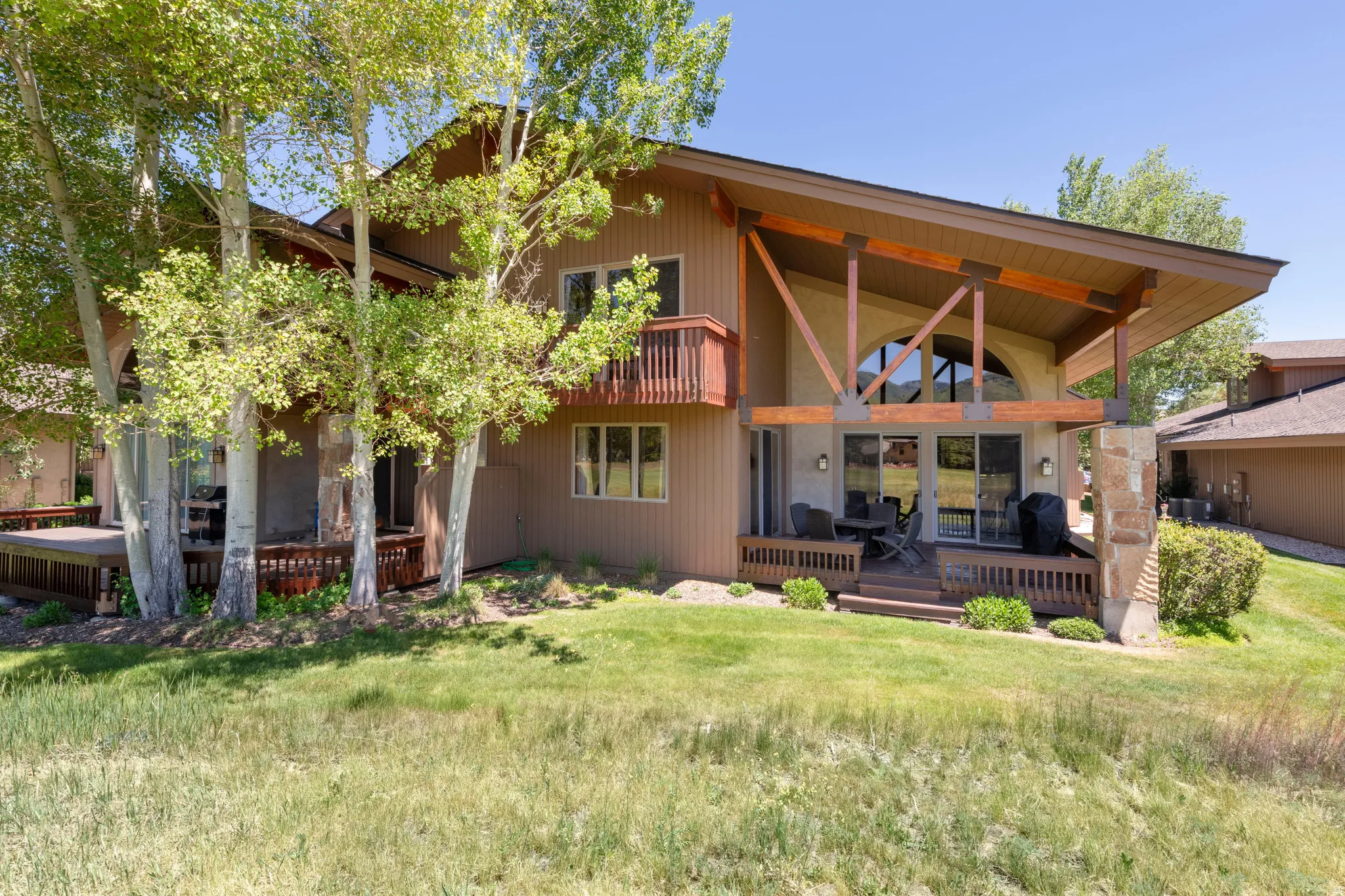 Contemporary-style exterior with a deep brown facade and expansive windows