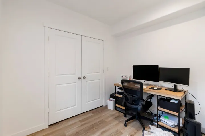 White walls complement the wood-finish flooring