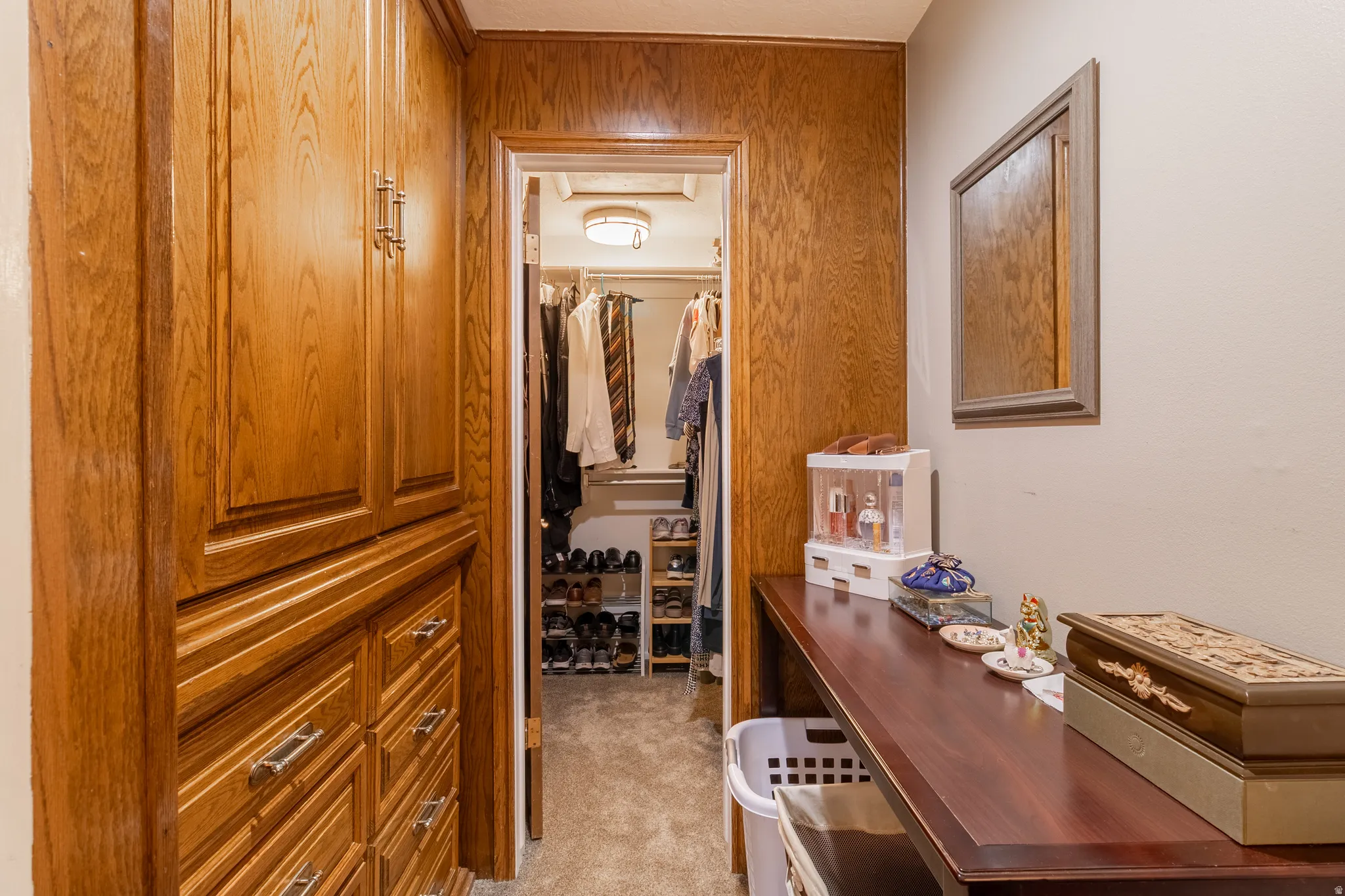 Dedicated dressing area featuring extensive built-in storage