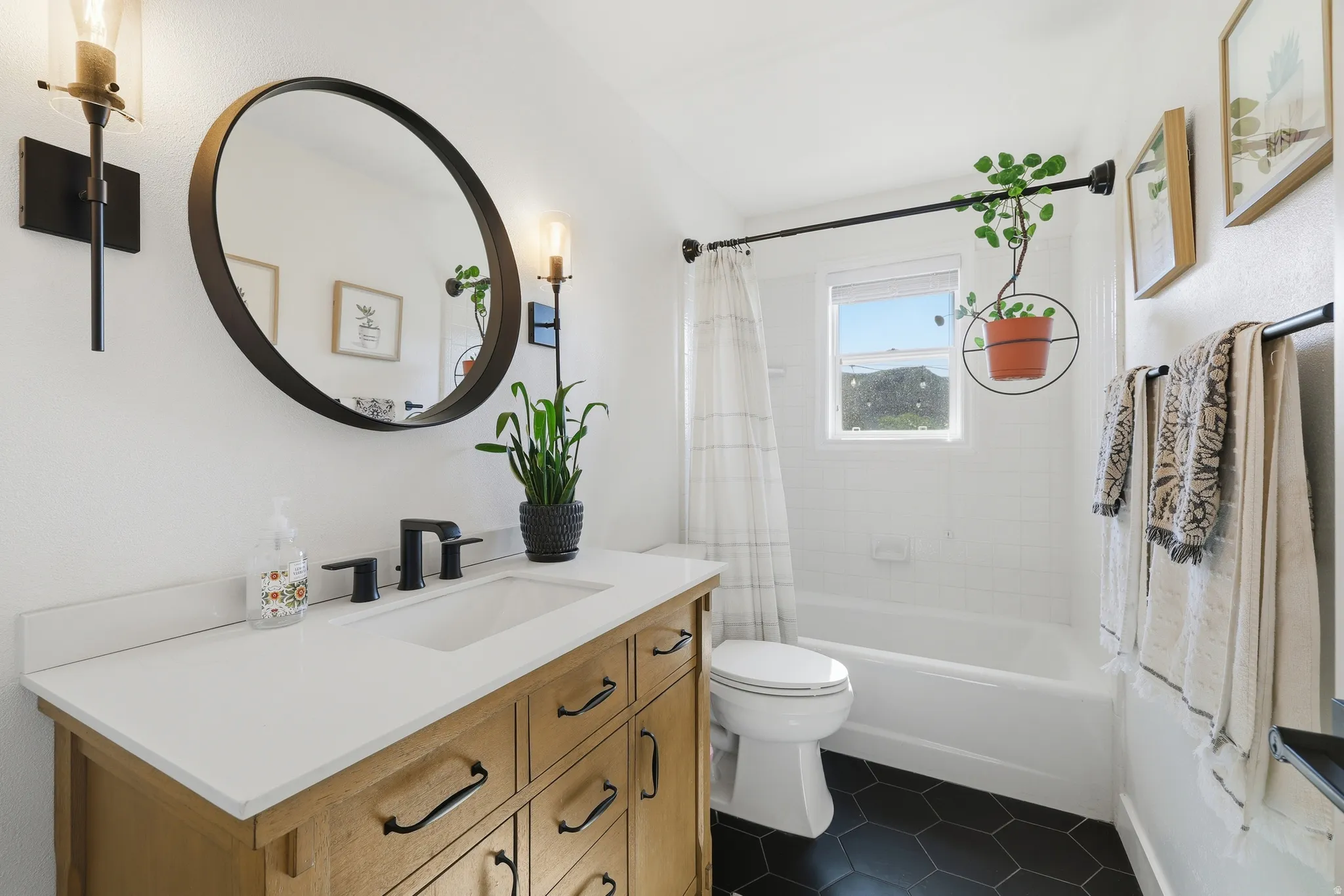 Wood-finish vanity with a white countertop and rectangular undermount sink