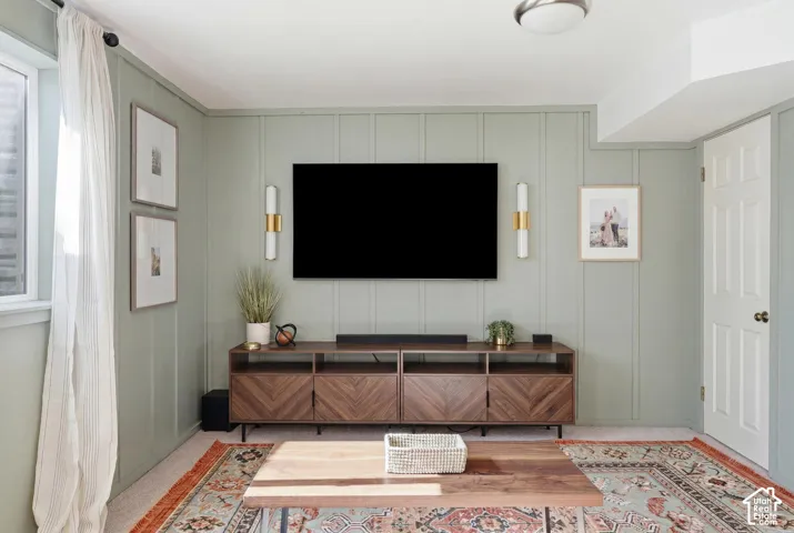 Vertical paneling accent wall with sconce lighting