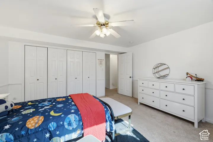 White walls and light-toned carpet create a bright interior