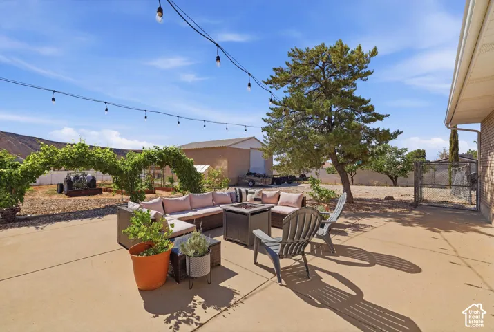Expansive concrete patio area with string lighting overhead