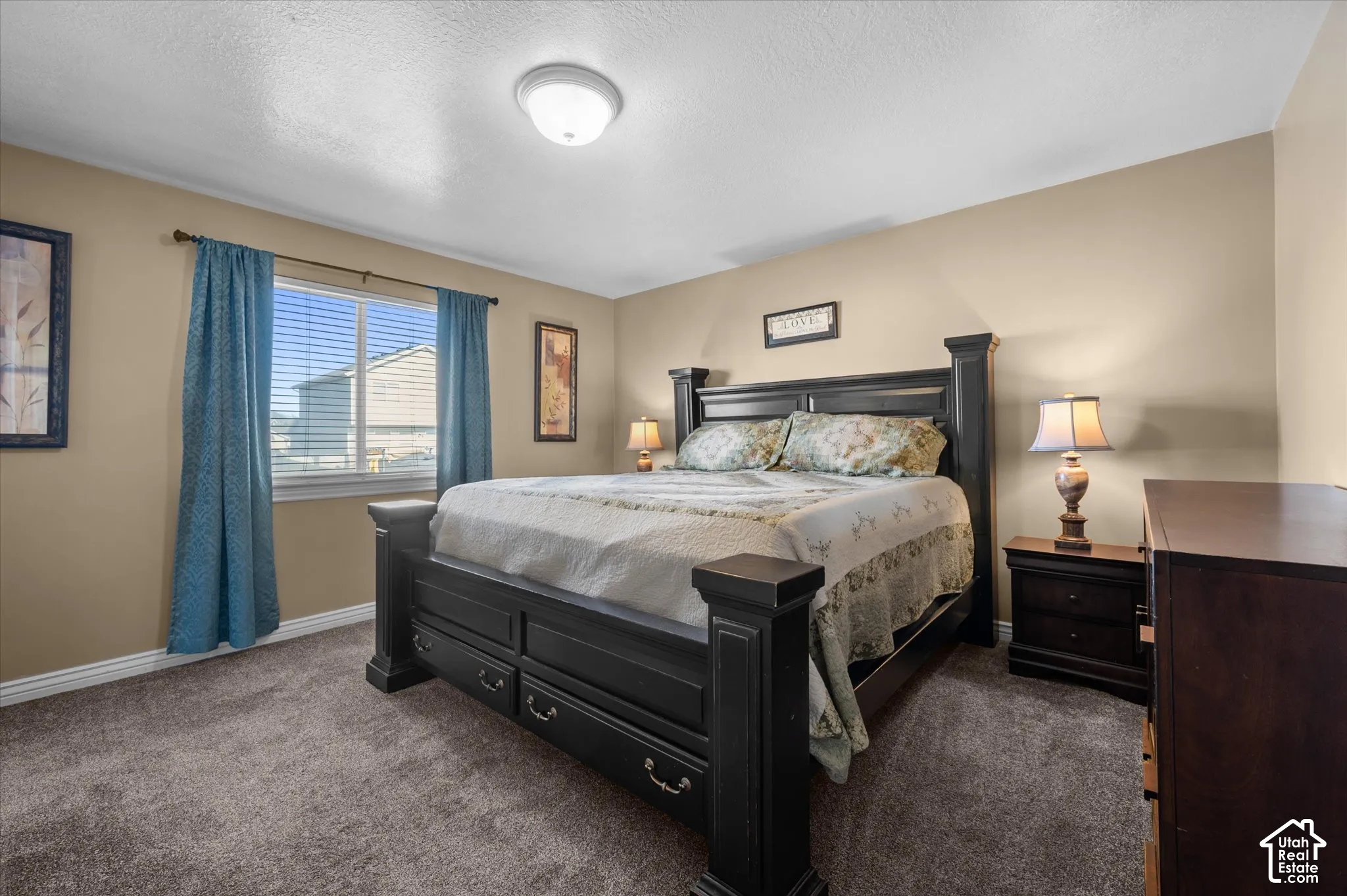 Neutral tone painted walls complement the carpeted flooring