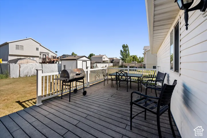 Expansive outdoor deck featuring composite decking and white railings