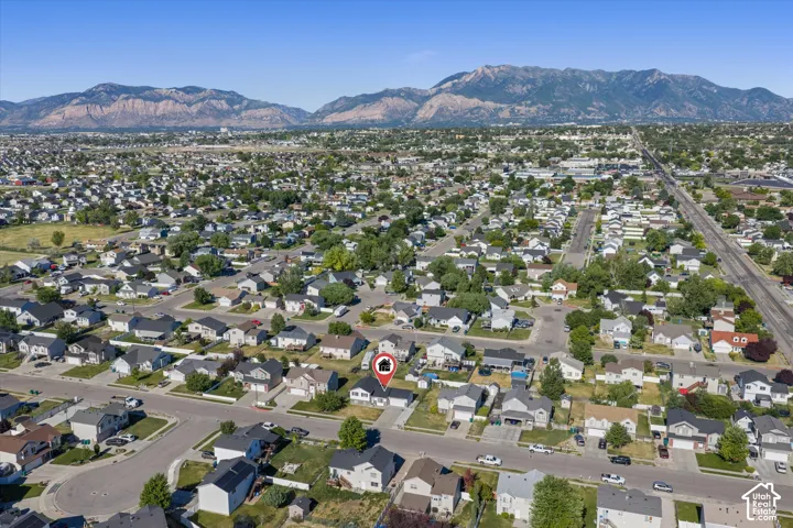 Aerial perspective showcasing the residential neighborhood with a distant mountain range backdrop