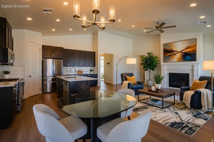 Open-concept living space with wood-finish flooring