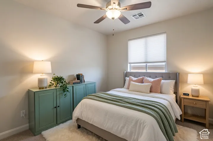 Bedroom featuring neutral wall colors, carpet flooring, a window with blinds, and a ceiling fan with integrated lighting Virtually Enhanced