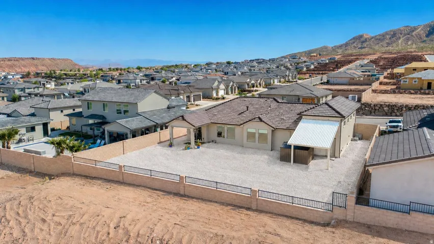 Single-story residence featuring a tile roof and stucco exterior