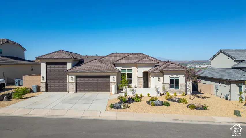 Contemporary stucco exterior with stone accents