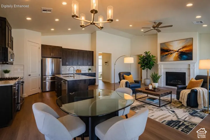 Open-concept living space with wood-finish flooring Virtually Enhanced