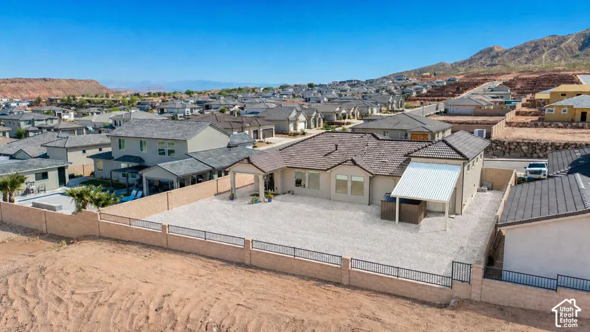 Single-story residence featuring a tile roof and stucco exterior